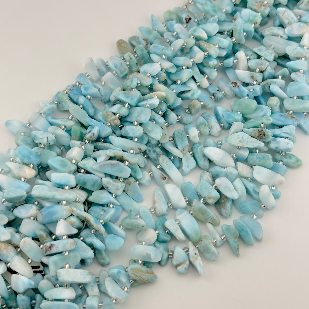 Бусины ларимар средний размер бусин 20*6мм натуральный камень